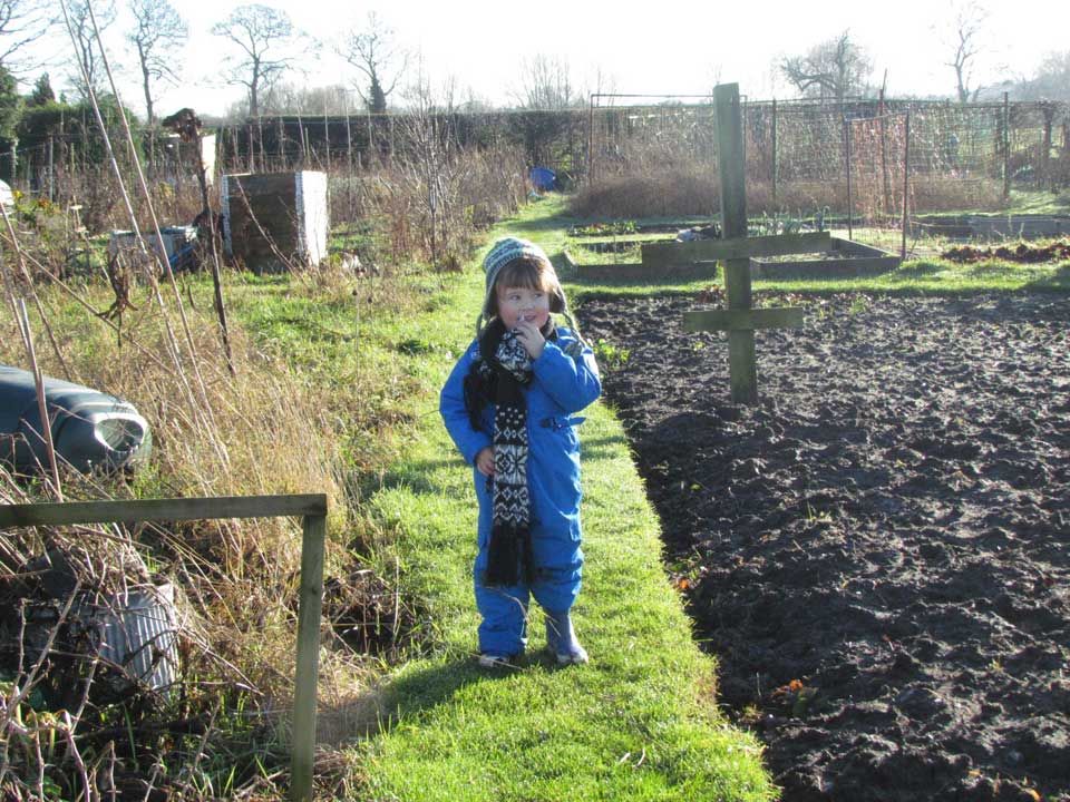 child at the allotment