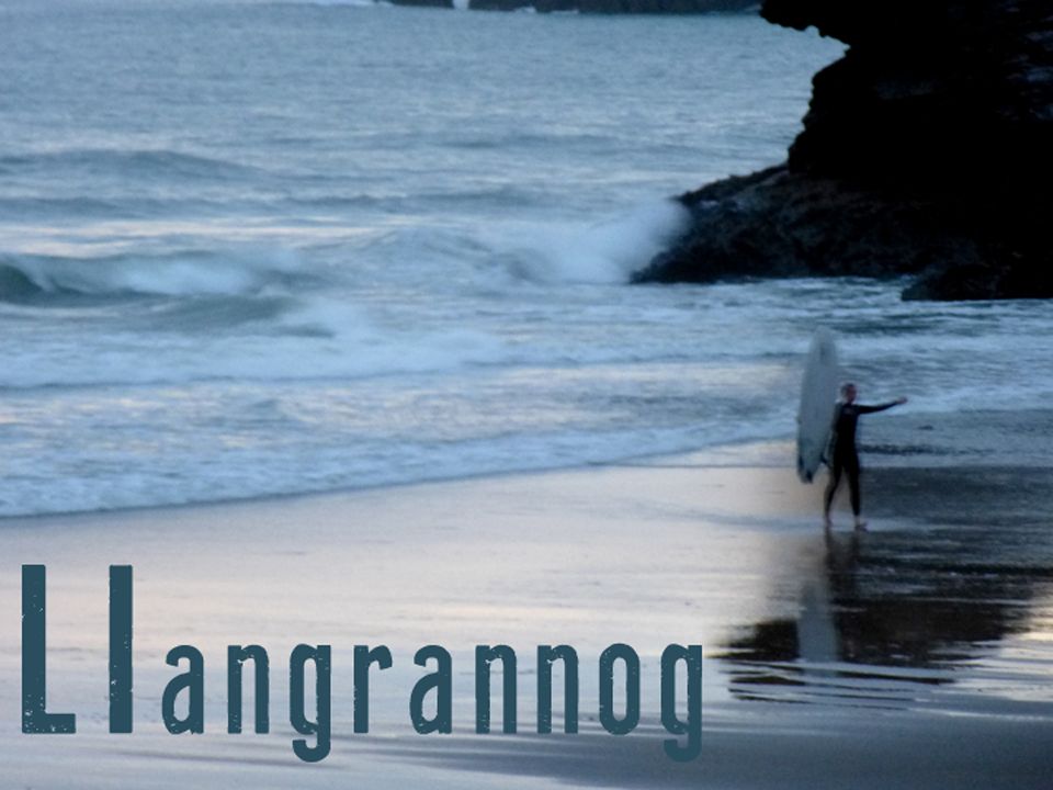 surfer at twilight Llangrannog
