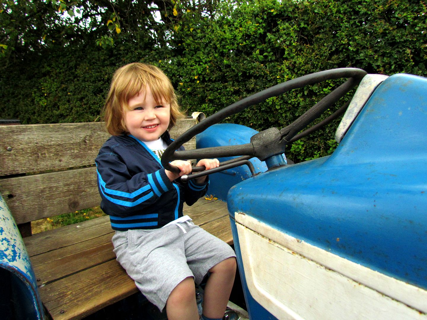 happy boy on the old tractor