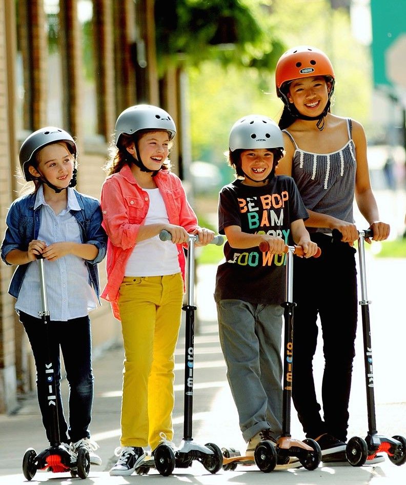 child on scooter