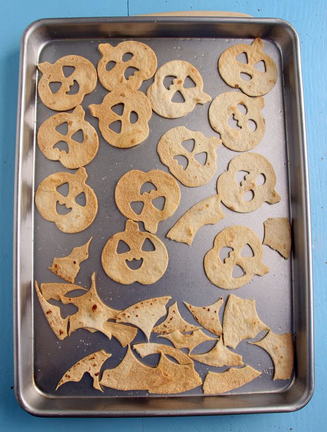 Jack-o-Lantern Tortilla Chips made with Halloween cookie cutters at MPMK