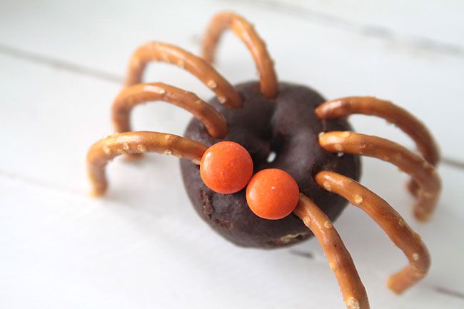 Easy Halloween party recipes: Mini donut spiders at It's Always Autumn