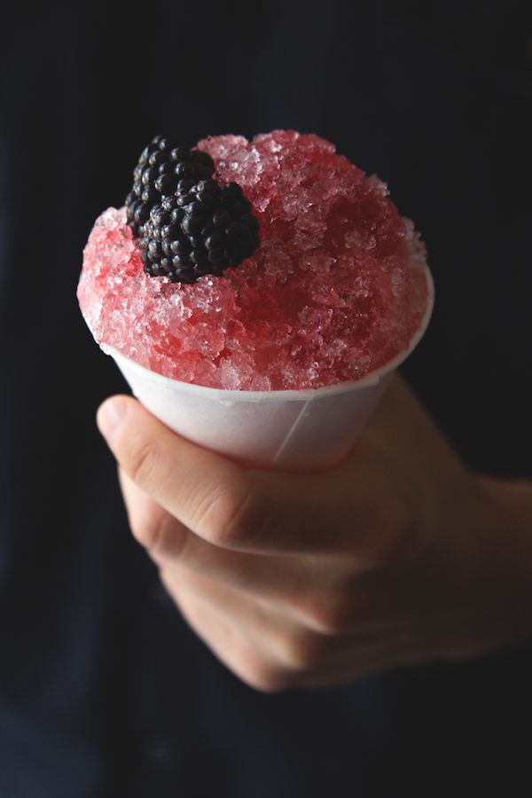 Creative frozen cocktail recipes: Blackberry cocktail snow cones at Honestly Yum