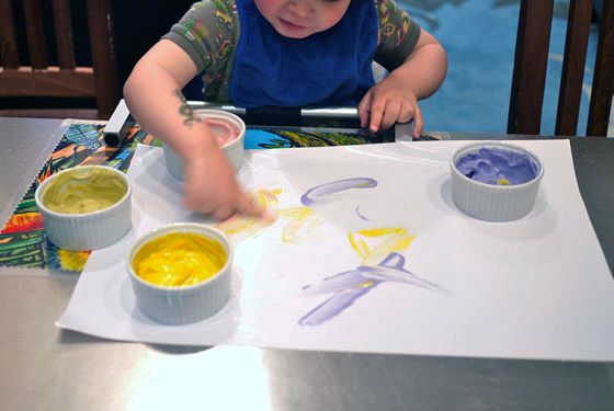 Play with your food! Hand your toddler some colored, slightly sweetened yogurt as an edible finger paint | Cool Mom Eats