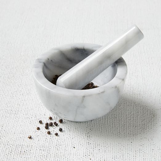 An affordable marble mortar and pestle from West Elm -- such a steal and perfect for the avid cook! | Gorgeous hostess gifts for under $50: Cool Mom Eats holiday gift guide