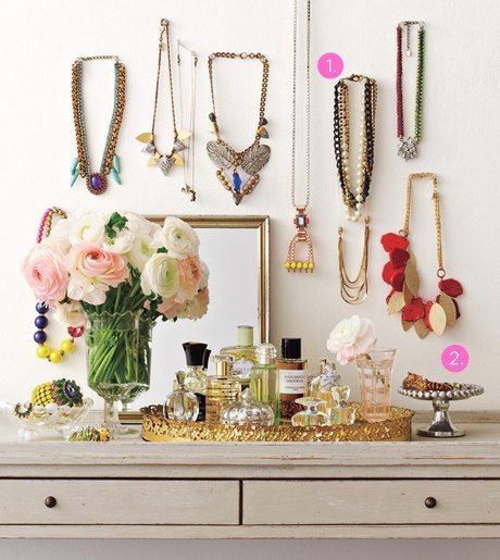 Show off your pretty jewelry by arranging it on a wall | photo by Lucky Magazine