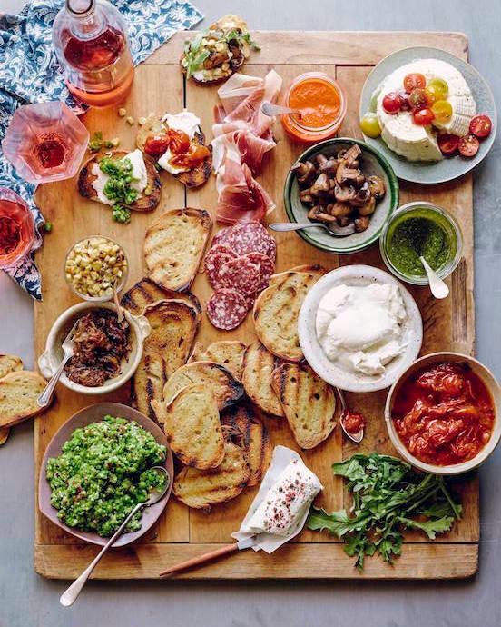 easy party hosting tips: set out a no-cook appetizer bar, like this bruschetta bar from What's Gaby Cooking? Delicious.