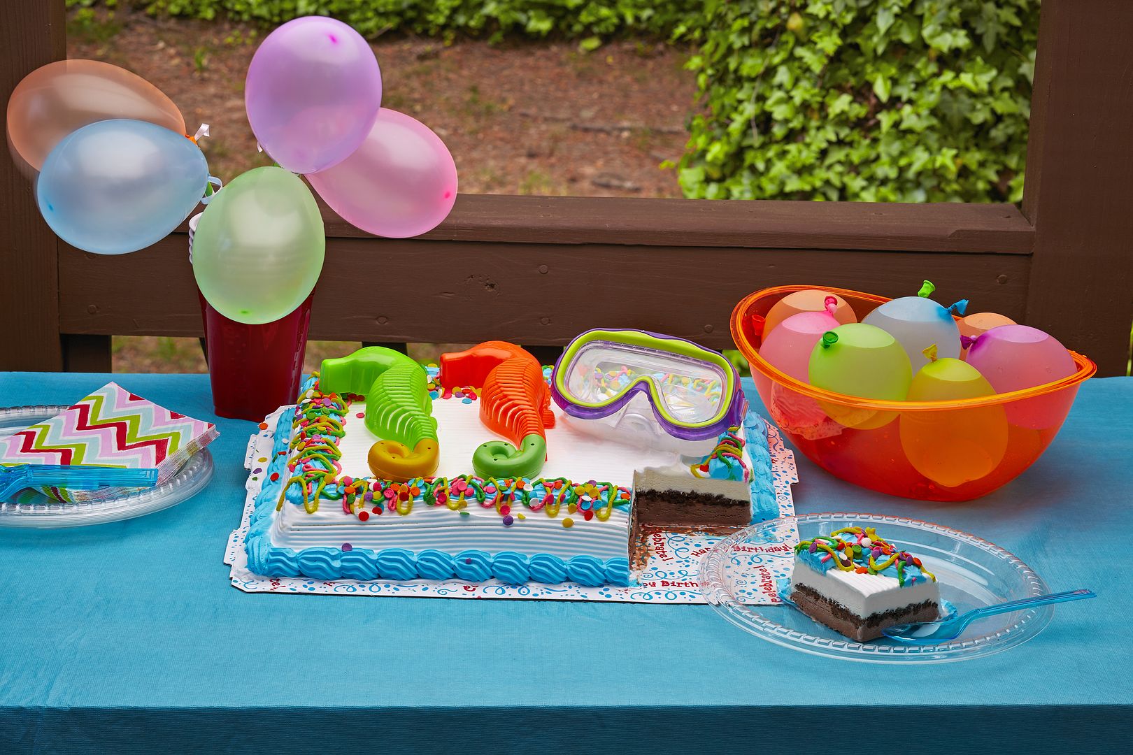Easy tips for decorating a simple Carvel ice cream cake from your grocer's freezer: Store bought toys make it fun!