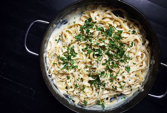 Truly a 30 minute dinner recipe, the sauce for this Skinny Fettucini Alfredo cooks in the same time that it takes to make pasta. Then, done! | One Hungry Mama
