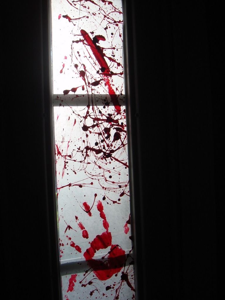 Zombie Party ideas: Muse Lodge's bloody handprint window coverings