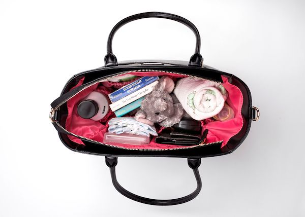 diaper bags that give back: the roomy interior of the Gabrielle bag from charlotte+asher