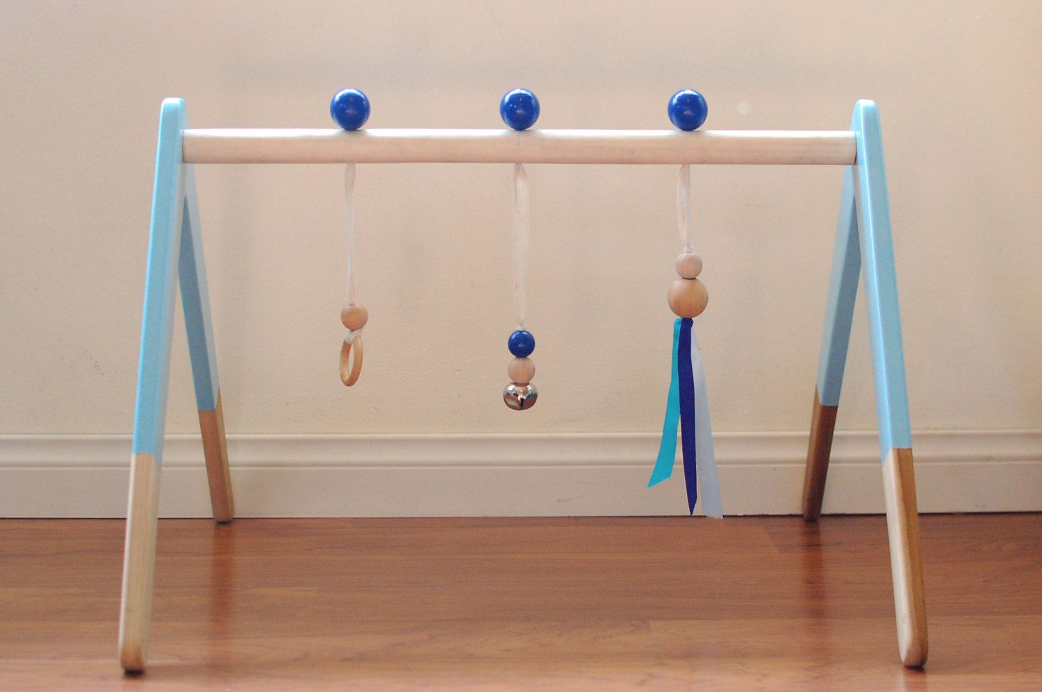Small Life Studio's wooden baby play gym on Etsy