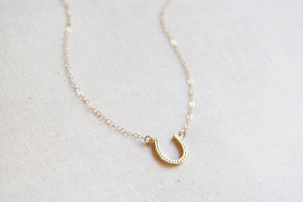 Affordable gifts for kids who love horses: a sweet, tiny horseshoe necklace from Amanda Deer Jewelry