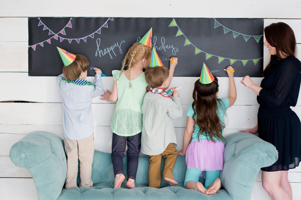 Jaq Jaq Bird Chalk Board Table Runner hung on the wall for a party