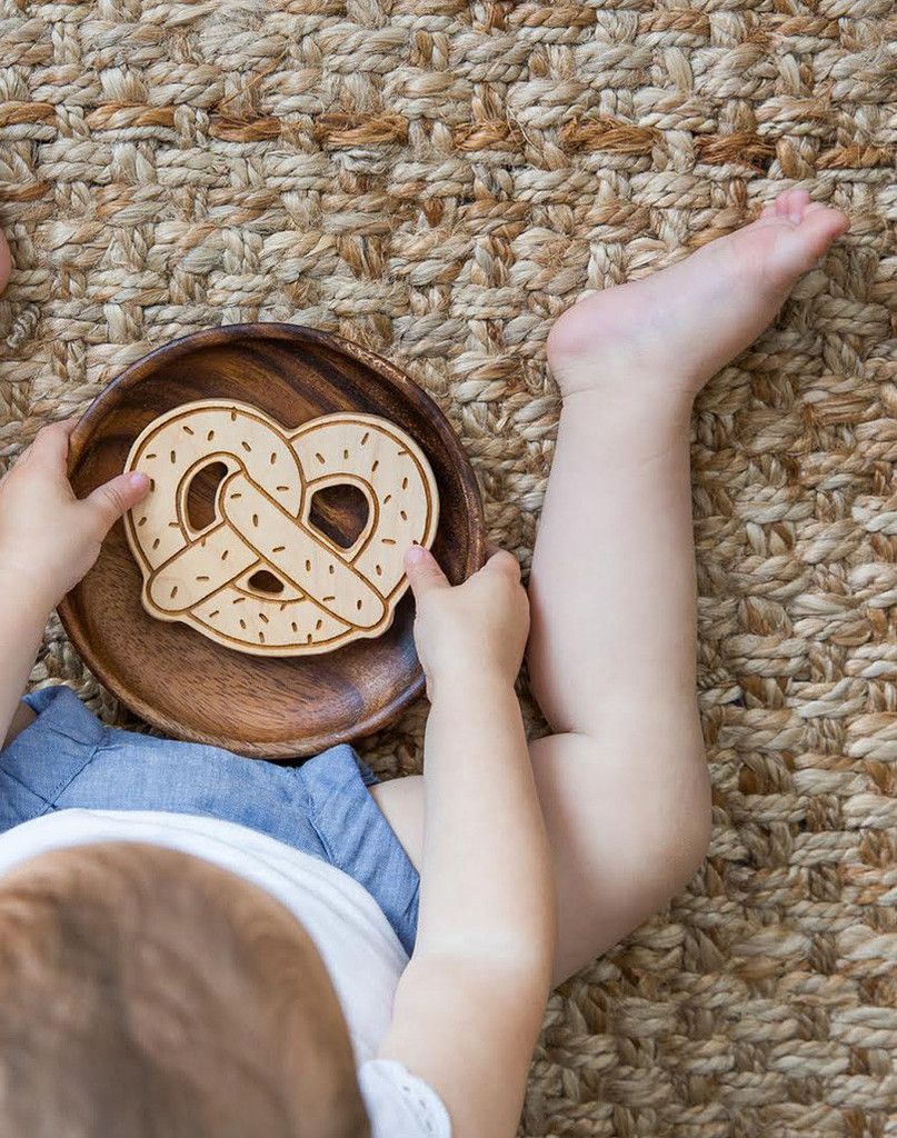 Cool Mom Eats holiday gift guide 2016: Food-themed stocking stuffers | wooden Lexypexy Pretzel Teether at Noble Carriage