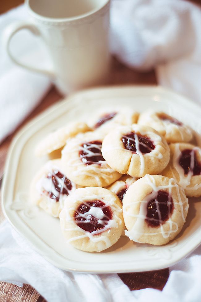 Delicious Christmas cookie recipes | Raspberry Almond thumbprint cookies at Dear Chrissy