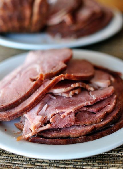 One of our favorite holiday dinner recipes is this Slow Cooker Maple Brown Sugar Ham, served with biscuits, of course! | Mel's Kitchen Cafe