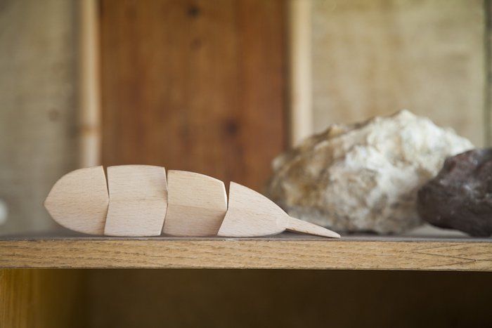 Tell someone you're thinking of them in the new year with this sweet wooden feather good luck charm at Areaware.