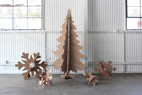 This Cardboard Christmas Tree from MettaPrints stores flat. Really flat.