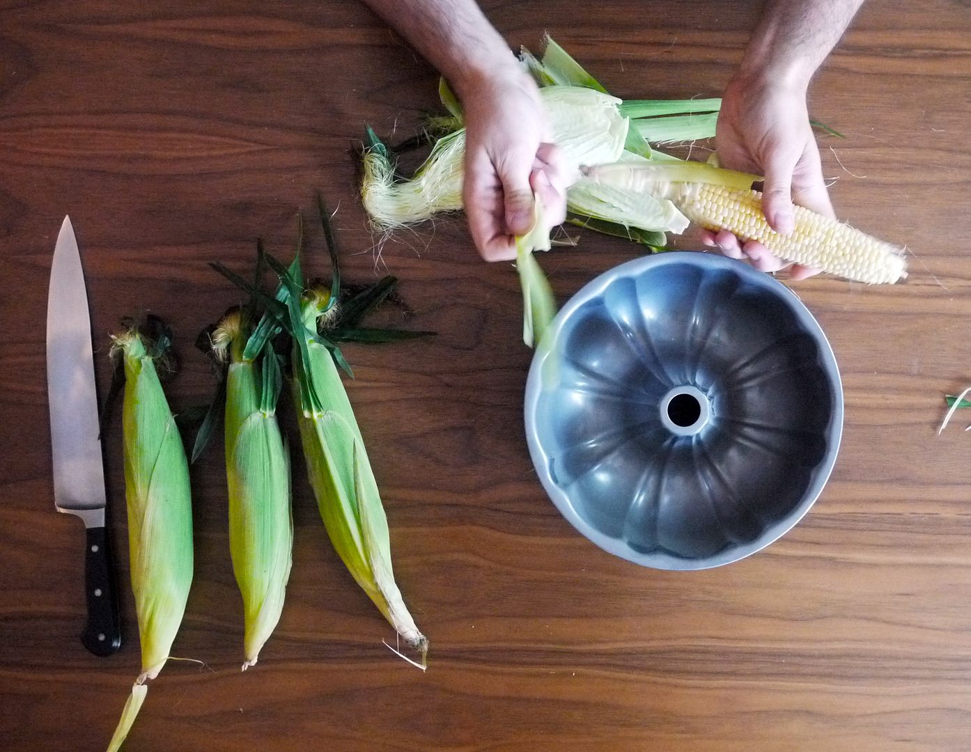 The first step in our foolproof method for how to cut corn off the cob without a huge mess: Shuck it! | Cool Mom Eats