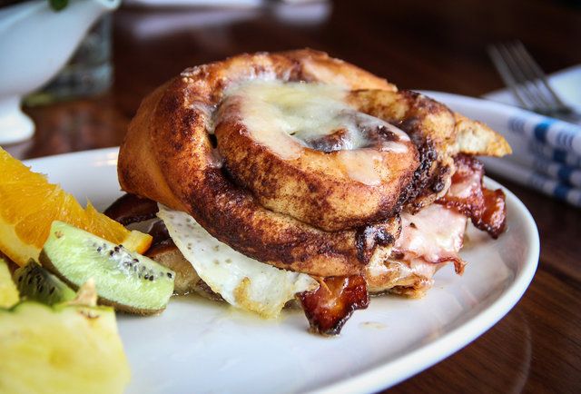 We're dying over this cinnamon roll breakfast sandwich, photographed by Sara Norris for Thrillist.