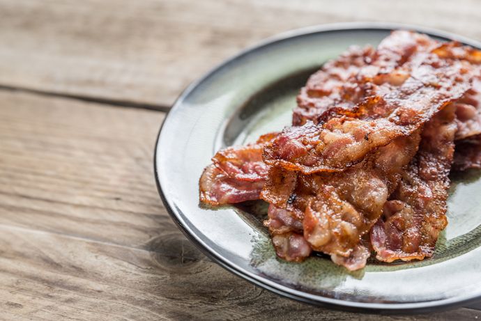 How to build a perfect breakfast sandwich: Bake thin-cut strips of bacon on a cookie sheet at 350 degrees for about 10 minutes for easy, perfectly crispy bacon and no mess! | Cool Mom Eats