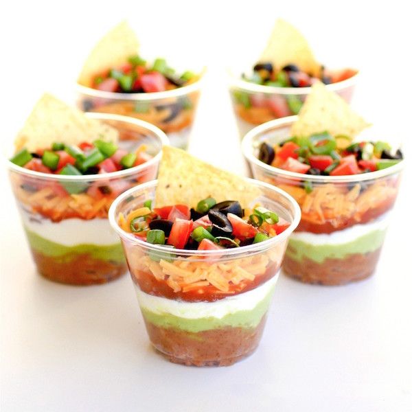Do double dipping here! Individual Seven Layer Dips take the mess out of scooping from the same bowl. | The Girl Who Ate Everything