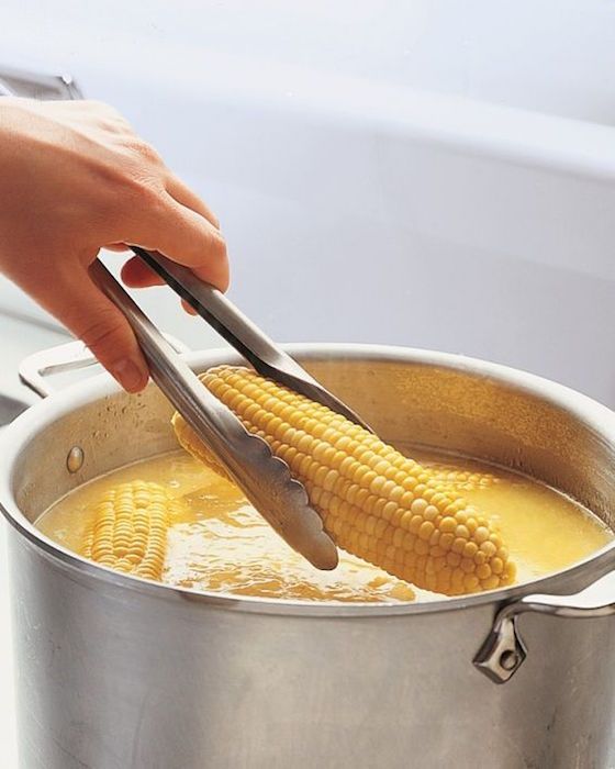 Even Martha loves a good summer party hack. Check out her tip for making Pre-Buttered Corn a breeze. | Martha Stewart