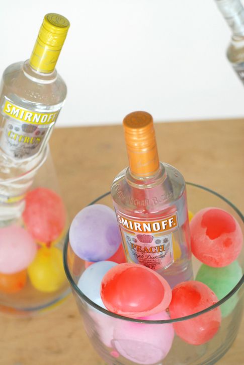 Beat the heat with summer party hacks, like this idea for chilling beverages with frozen water balloons. | A Subtle Revelry