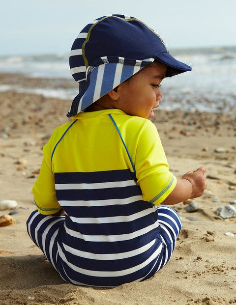 Common mistakes parents make applying sunscreen: Use the help of UPF hats (like this one from Boden) and swimwear to give your kids extra protection.