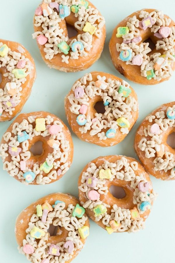 Holy Easy Lucky Charms treat! These Lucky Charms donuts are the perfect St. Patrick's Day treats—and semi-homemade, so they're easy to make with store bought donuts! | Studio DIY