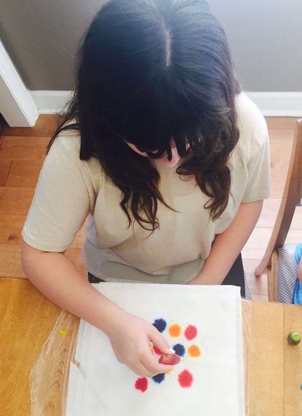 Step 2 for tie-dyed Easter eggs: create a pattern with food coloring.