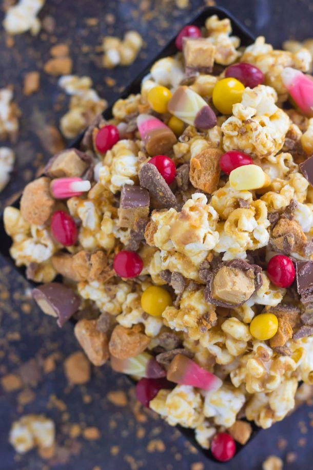 How to use your leftover Halloween candy: Make your next movie night indulgent with this Peanut Butter Candy Popcorn at Pumpkin n Spice