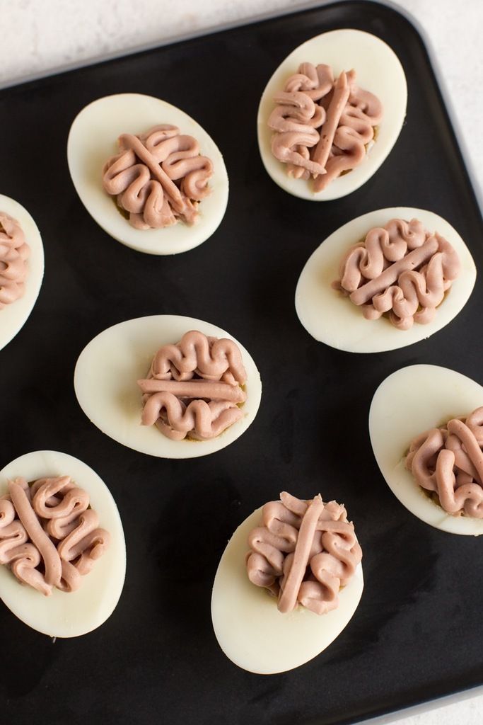 Non-candy Halloween snack recipes: Deviled Egg Brains. Because yummy tasting, but gross looking. What every Halloween treat should be! | Brit + Co