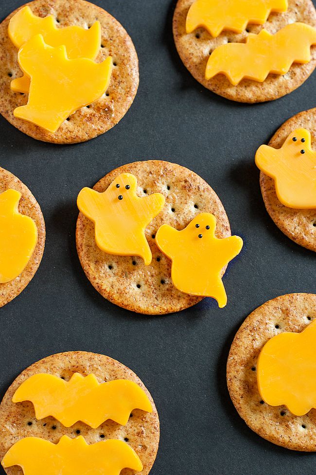 Making cute non-candy Halloween snacks is easy when all you have to do is take a cookie cutter to some cheese for these Halloween Cheese and Crackers at Peas and Crayons