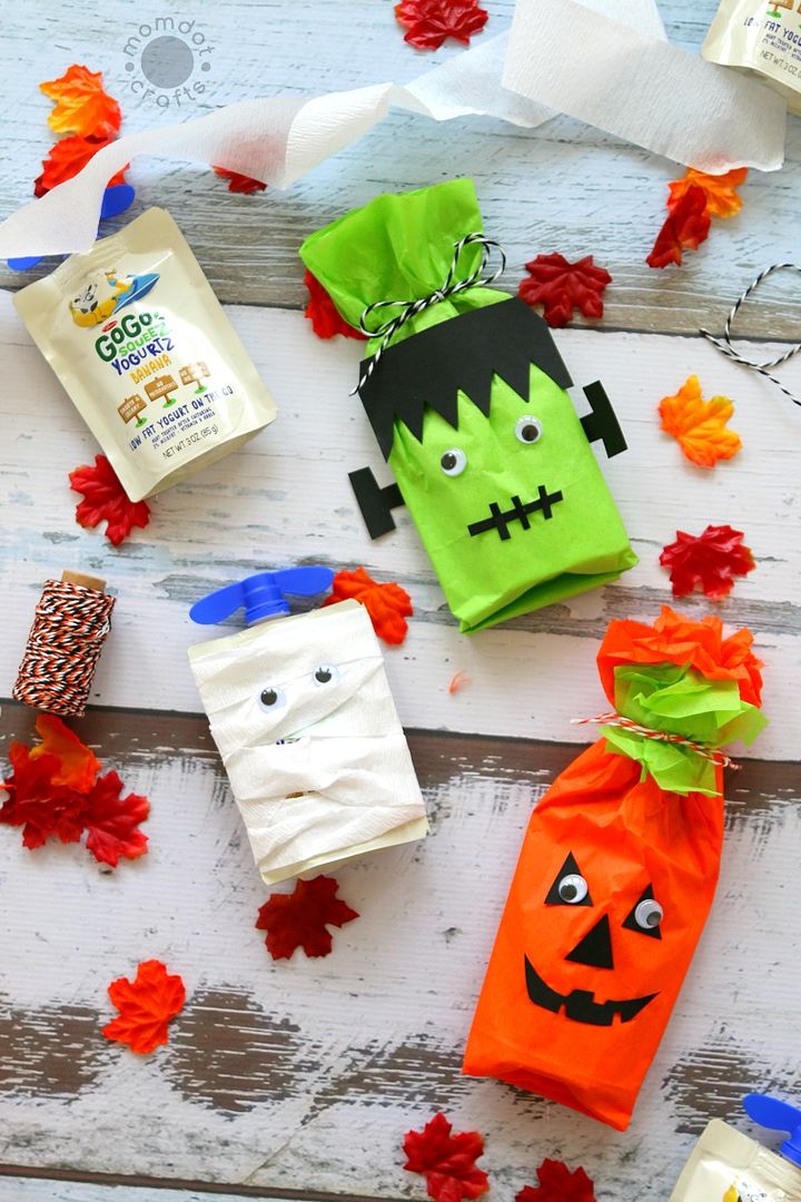 This idea for non-candy Halloween treats cleverly disguises healthier squeeze snacks as mummies, Frankenstein and jack-o-lanterns. So smart! | MomDot