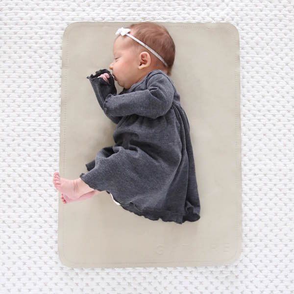 Gathre's micro bonded leather playmat doubles as a changing pad for baby. So smart!