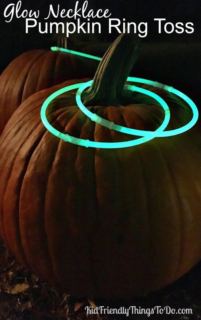 best Halloween games for kids: After the sun goes down, keep the party going with this glow necklace ring toss game idea at Kid Friendly Things to Do.