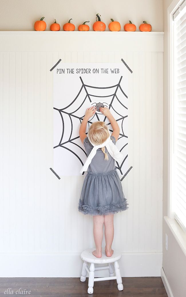 best Halloween games for kids: We love this spooky twist on the classic, Pin the Spider on the Web at Ella Claire Inspired.