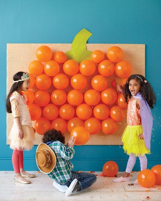 best Halloween games for kids: Fill the balloons on this balloon pumpkin at Martha Stewart with candy or tattoos for an extra treat.
