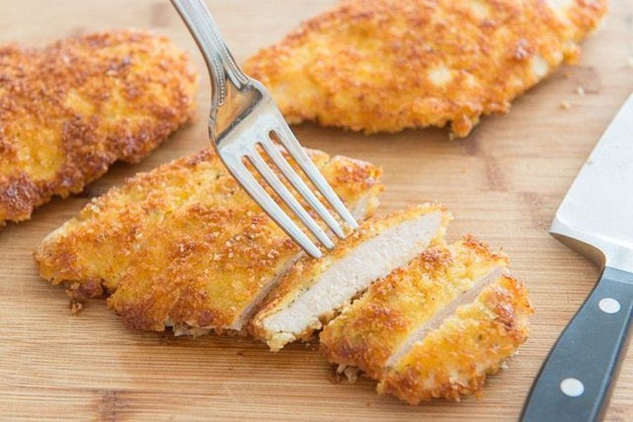 How to pound chicken breasts: Use our super easy method and then whip up this quick Parmesan Crusted Chicken, a family-favorite dinner at Fifteen Spatulas