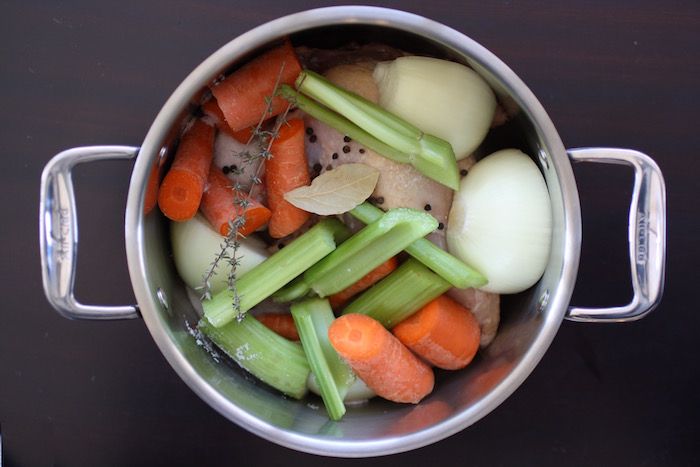 Our simple recipe for how to make chicken soup from scratch requires only 1 chicken and a few veggies. | Cool Mom Eats