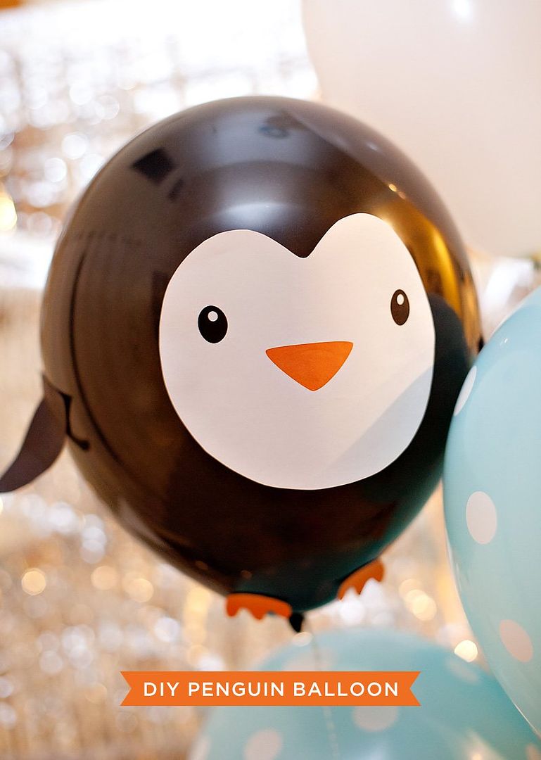 Winter birthday party themes: DIY penguin balloon by Hostess with the Mostess