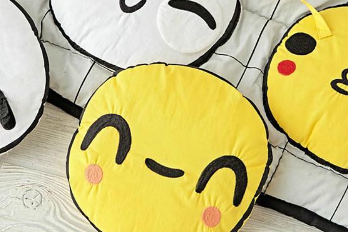 What's not to love about the Emoji Activity Baby Play Mat from Land of Nod?
