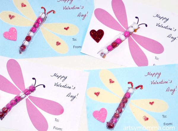 Free printable Valentines for the classroom: Dragonflies meet candy in these sweet cards by Artsy Momma.