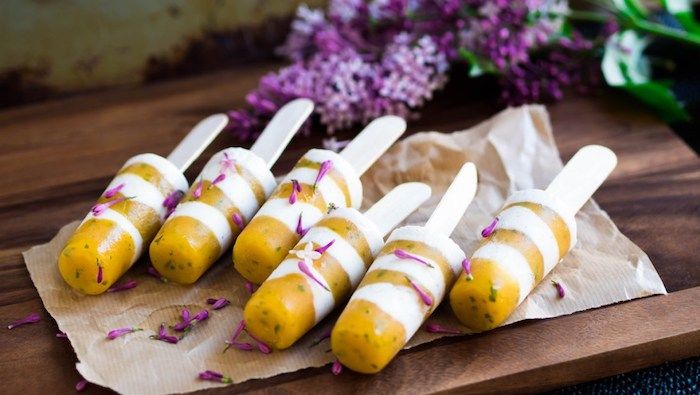 Gourmet popsicle recipes: Mango Bourbon Vanilla Yogurt popsicles at Put Your Heart In It