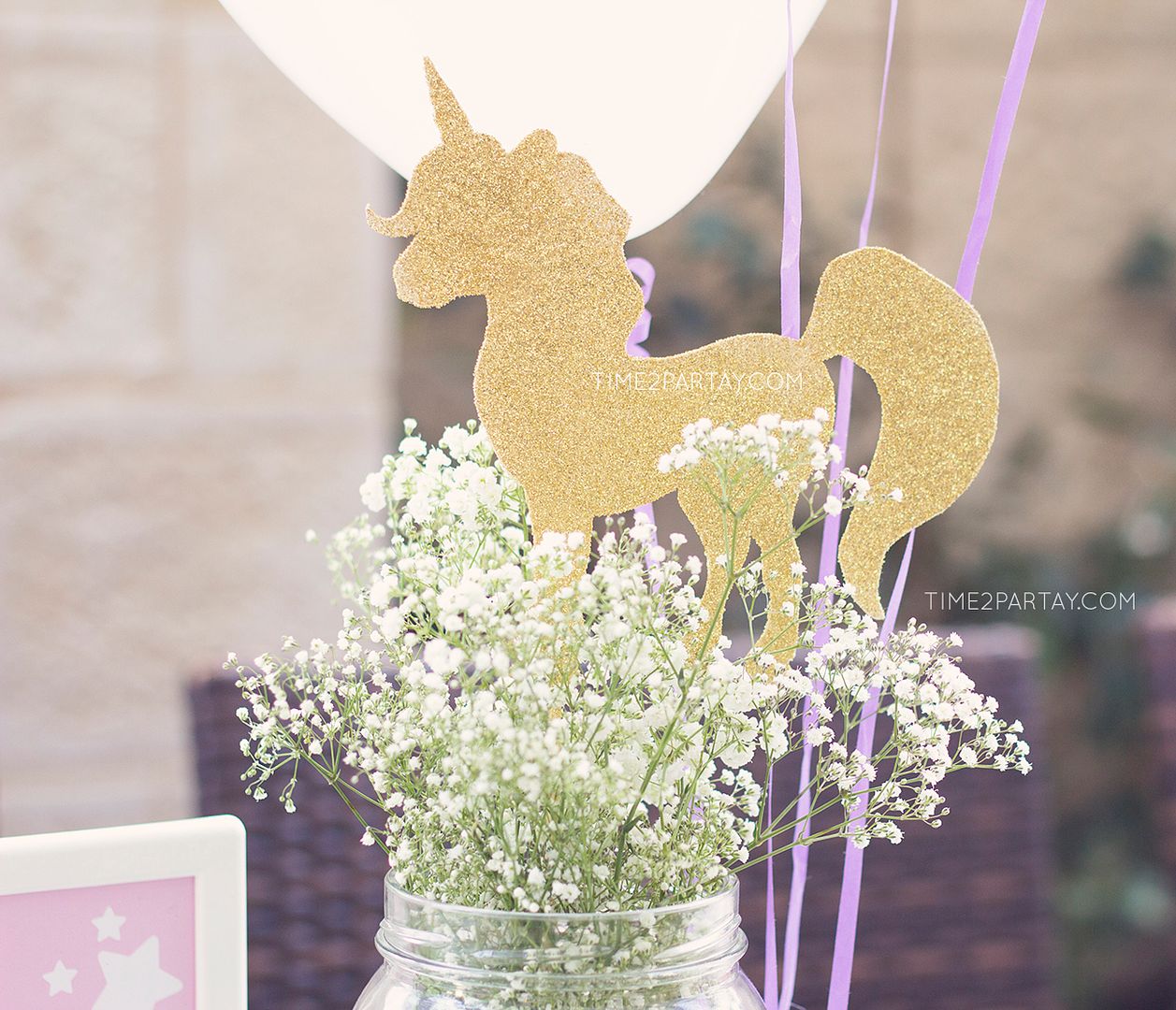 Unicorn birthday party ideas: Gold glittery unicorn ornaments by Time 2 Partay