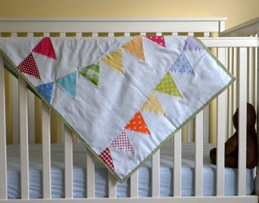 diy handmade rainbow bunting quilt tutorial at a pretty cool life | baby shower gift guide diy handmade rainbow bunting quilt tutorial at a pretty cool life | baby shower gift guide
