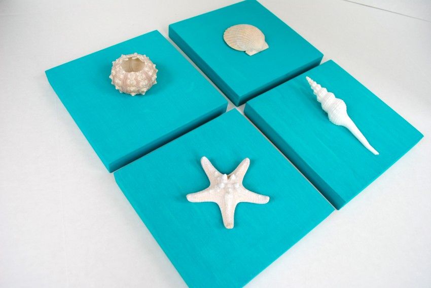 Paint canvases to match your decor, add shells, and you have easy wall art via The Party Teacher