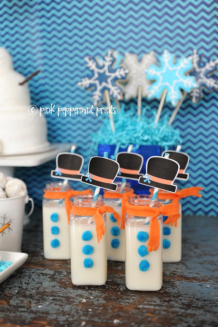 Winter birthday party themes: DIY snowman milk bottles by Pink Peppermint Design
